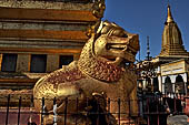 Bagan Myanmar. Shwezigon pagoda. Double bodied lions guard the corners of the pagoda. 